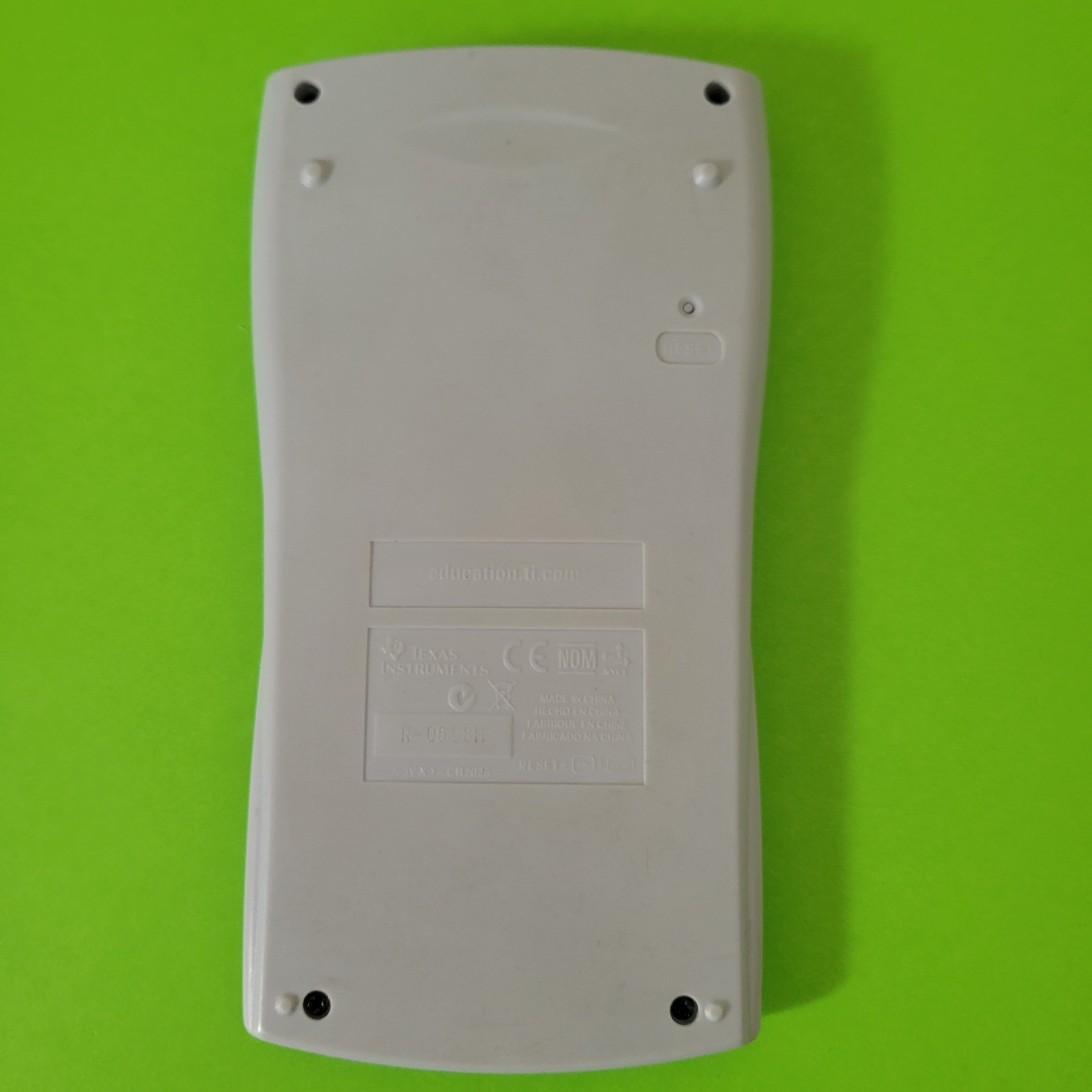 An image of the back of a texas instruments ti30xiib scientific/engineering calculator